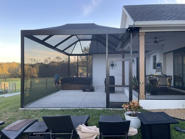 Custom screen enclosure at dusk