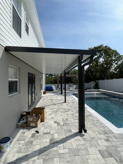 Aluminum pergola alongside a pool