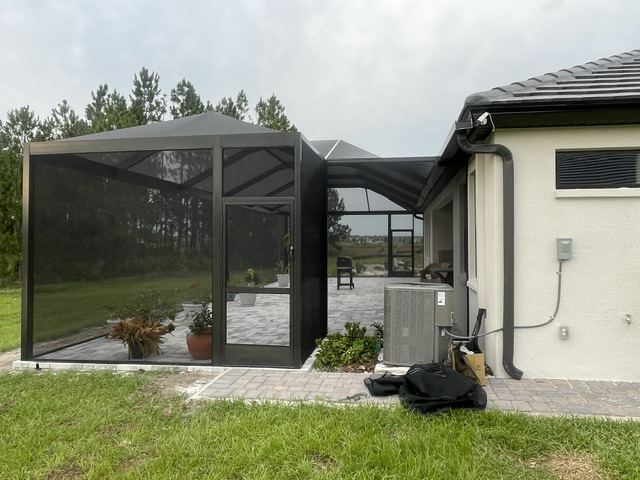 Screen enclosure with entry door
