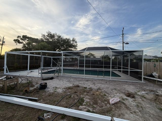 Pool enclosure frame at sunset